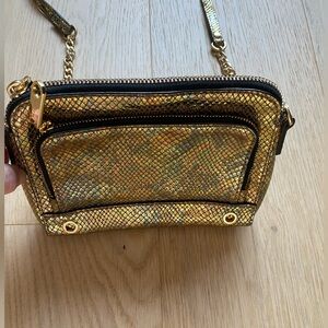 MILLY gold crossbody mini handbag with gold chain detail.